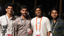 Four friends posing at a tech event
